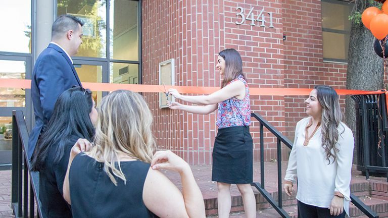 A ribbon-cutting takes place for the new Benerd College