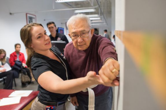 a student working with a patient