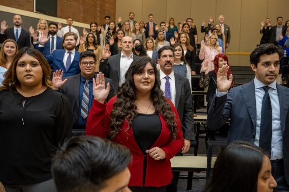 A group of law students take an oath.