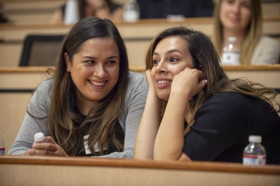 Two law students sit in a classroom.