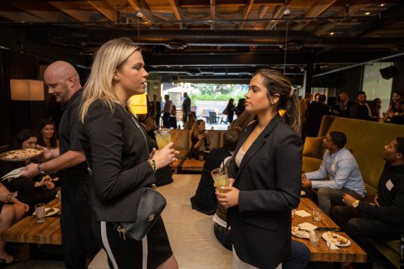 Law students talk in a restaurant.