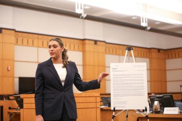 Law student competing in a trial advocacy competition.