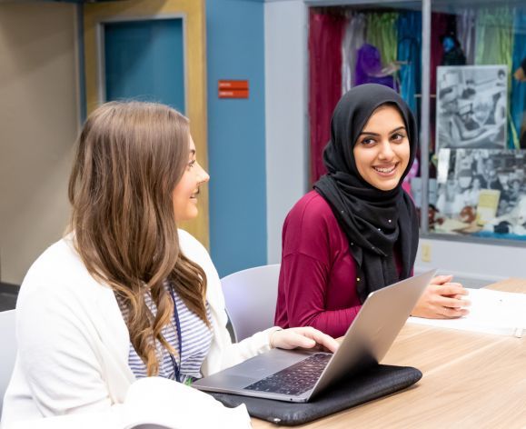 two female students in class
